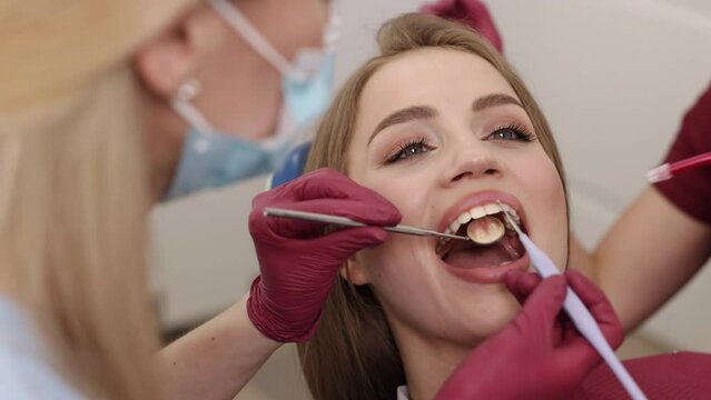 Dental check up, Caries prevention, Oral treatments. Doctor's examination of oral cavity prioritizes detection of tooth decay and prevention and treatment of caries.