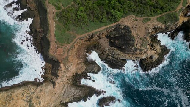 Above the cliffs: bird's eye of sea, sand y rocks at Punta Cometa, Mazunte, Oaxaca, Mexico