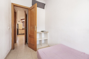 Bedroom with small bed and white square