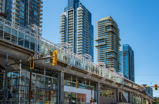 View of Skytrain station Metrotown, Vancouver City, BC, Canada. Modern downtown of Burnaby city in summer day