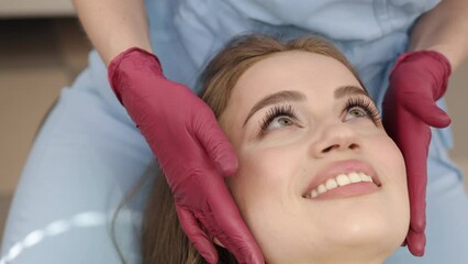 Jaw inspection, Dental diagnosis, Patient consultation. Female patient is having her jaw joints palpated by orthodontist-gnathologist.