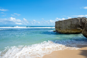 Sandy beach with the blue ocean