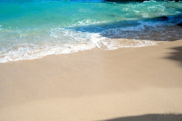 Sandy beach with the blue ocean