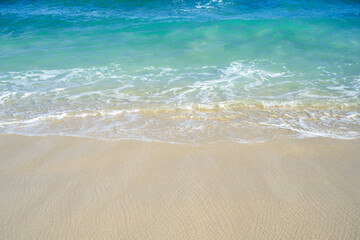 Sandy beach with the blue ocean
