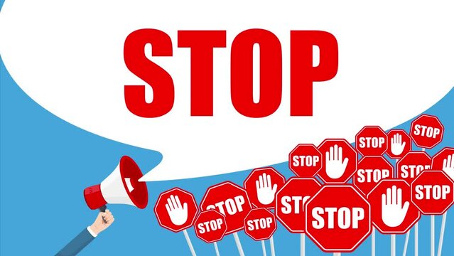 Hand holding megaphone with stop sign. Protest and revolution concept. Stop bullying with megaphone