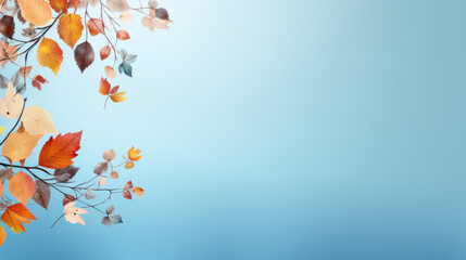 Vertical border with autumnal foliage on blue background with space for text.
