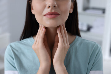 Endocrine system. Woman doing thyroid self examination indoors, closeup - obrazy, fototapety, plakaty