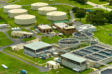Aerial view of modern water cleaning facility at urban wastewater treatment plant. Purification process of removing undesirable chemicals, suspended solids and gases from contaminated liquid