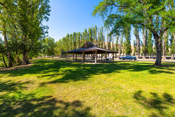 A small gazebo along the Wenatchee River at the Wenatchee River County Park in the high desert region of Central Washington State at the town of Monitor, Washington.