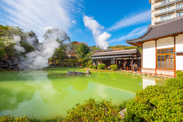 Beppu, Japan - Nov 25 2022: Shiraike Jigoku hot spring in Beppu, Oita. The town is famous for its onsen (hot springs). It has 8 major geothermal hot spots, referred to as the "eight hells of Beppu"