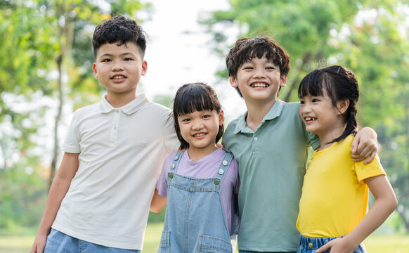 group of cute asian kids having fun in the park