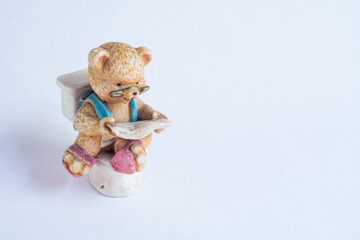Bear with glasses take time to relax with reading newspaper in bathroom, relaxation comedy