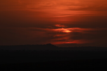 Kenyan Sunset with Mountain Silhouette