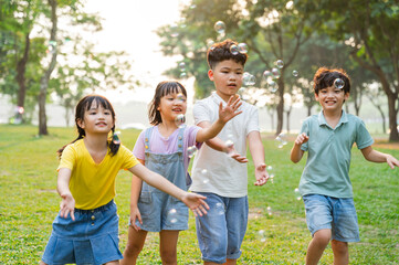 Fototapeta premium group image of cute asian children playing in the park