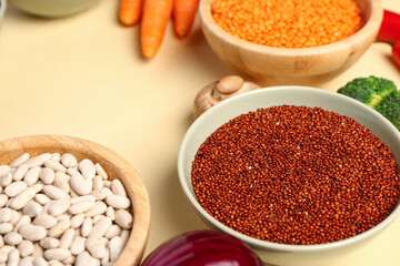 Different fresh vegetables and cereals on yellow background, closeup