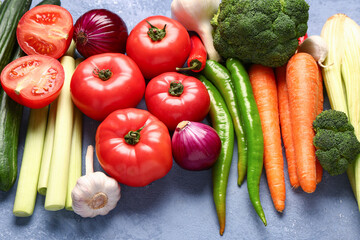 Different fresh vegetables on blue background