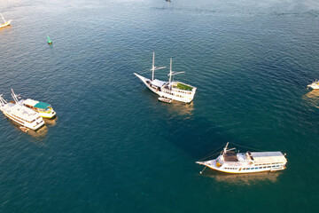 Labuan Bajo port - Rush Hour view in Labuan Bajo Harbour in the morning with Luxury Phinisi view Sailing Komodo National Park 