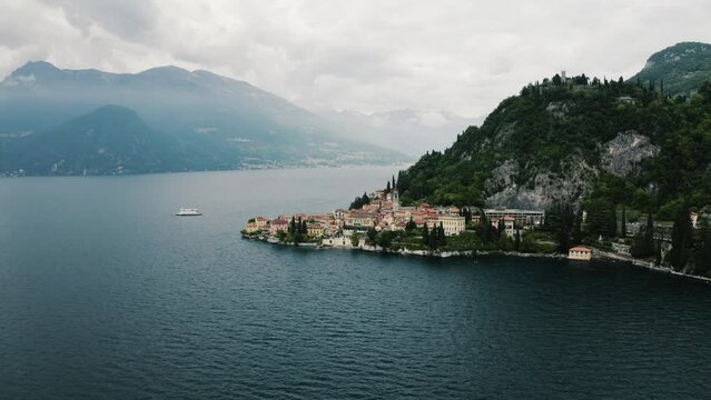 Drone shot pulling away from Varenna, Italy on the shore of Lake Como.