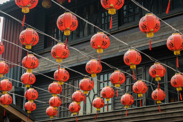 Red lanterns hang on the ceiling at Jiufen Old Street, Taiwan.