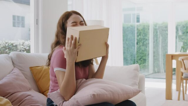 FasAsia people young woman smile love hug parcel box goods carton packaging happy joy awe face at home. Omni channel enjoy buy gift order postal at retail online shop store fast courier sending servic