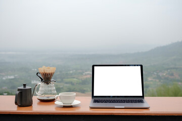 I sat at the top of the mountain, working on my laptop with balnk white screen and dripping coffee...