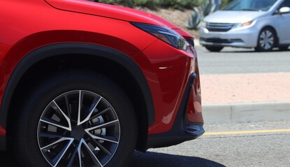 Fototapeta na wymiar Closeup of red SUV in motion. 