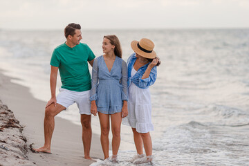 Happy family on the beach during summer vacation