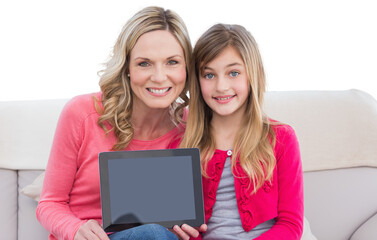 Digital png photo of caucasian mother and daughter using tablet on transparent background