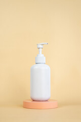 Soap bottle pump mockup on podium isolated