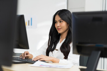 Asian, business woman and office. Young Asian business woman working with desktop computer in the office