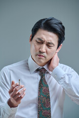 Middle-aged man struggling to quit smoking, smoking