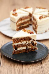 Classic carrot cake with cream cheese frosting, pecan, walnut and raisin