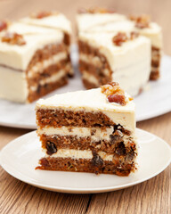 Classic carrot cake with cream cheese frosting, pecan, walnut and raisin