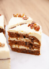 Classic carrot cake with cream cheese frosting, pecan, walnut and raisin