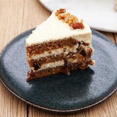 Classic carrot cake with cream cheese frosting, pecan, walnut and raisin