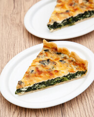 a piece of classic spinach quiche