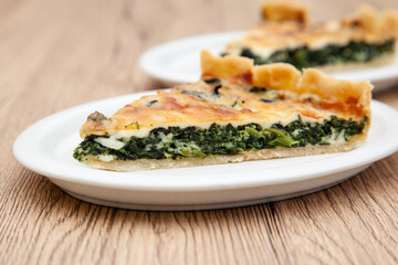 a piece of classic spinach quiche