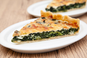 a piece of classic spinach quiche