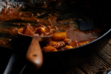Close up of brown curry in the pan