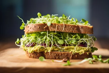 Foto op Canvas Avocado sandwich with microgreen sprouts on wooden cutting board. © SERHII