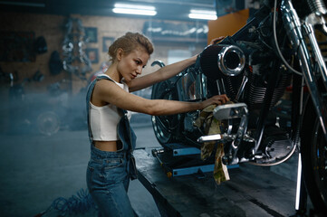 Mechanic female working at bike maintenance service