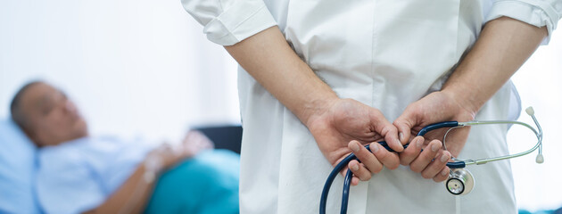 Doctor take care of patient in hospital.