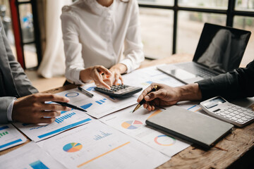 Business People Planning Strategy Analysis Office Concept. writing notes about sticky notes Laptop,tablet  Planning and Brainstorming Strategies of Colleagues..