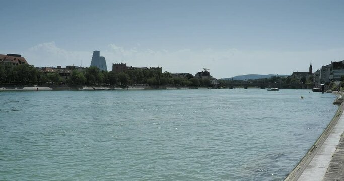 Swiss. Basel City.  Banks and ferries on the rhine. Cable ferry across the Rhine between City and old medieval City (Kleinbasel) with view of  Klingental museum, kHaus and Roche Tower