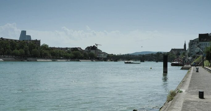 Swiss. Basel City. Rhine Promenade. Cable ferry across the Rhine between City and old medieval City (Kleinbasel) with view of  Klingental museum, kHaus and Roche Tower