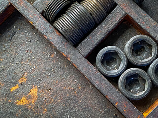 Detail of different metallic bolts and nuts in the toolbox