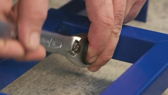 the worker who repairs and installs the toilet bowl and flush uses tools such as pliers and spanners.