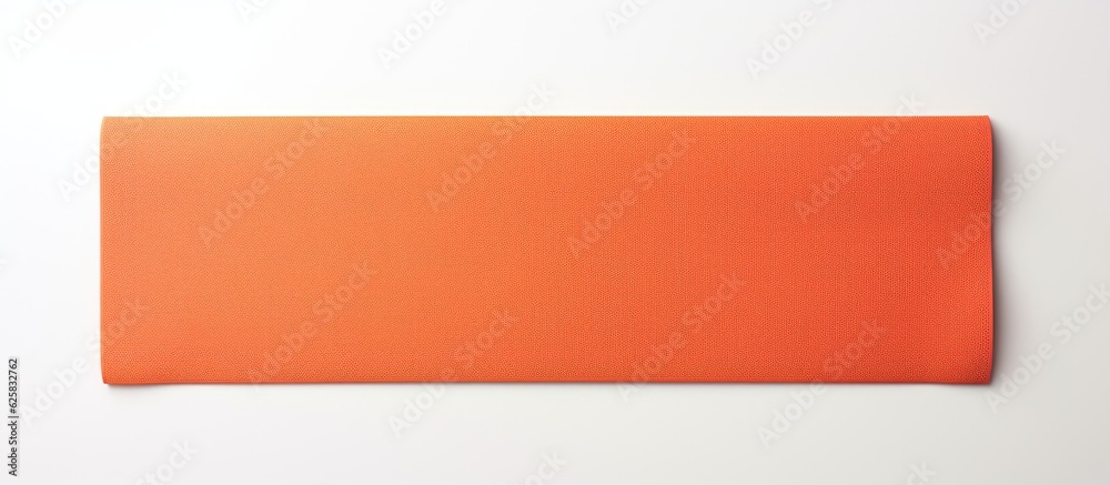 Leinwandbilder photo of an orange piece of paper on a white background with plenty of space for text or other eleme