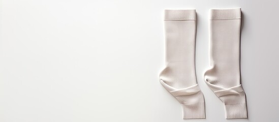 Photo of a pair of neatly folded white socks on a clean surface with copy space
