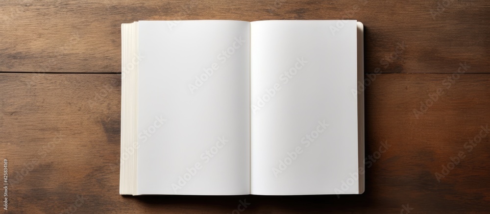 Poster Photo of an open book on a wooden table with plenty of space for writing or doodling with copy space